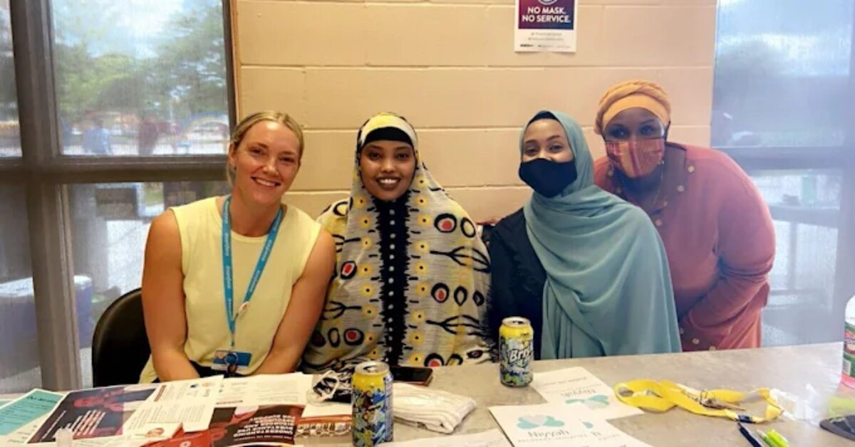 iZone Corp team members at a community outreach table